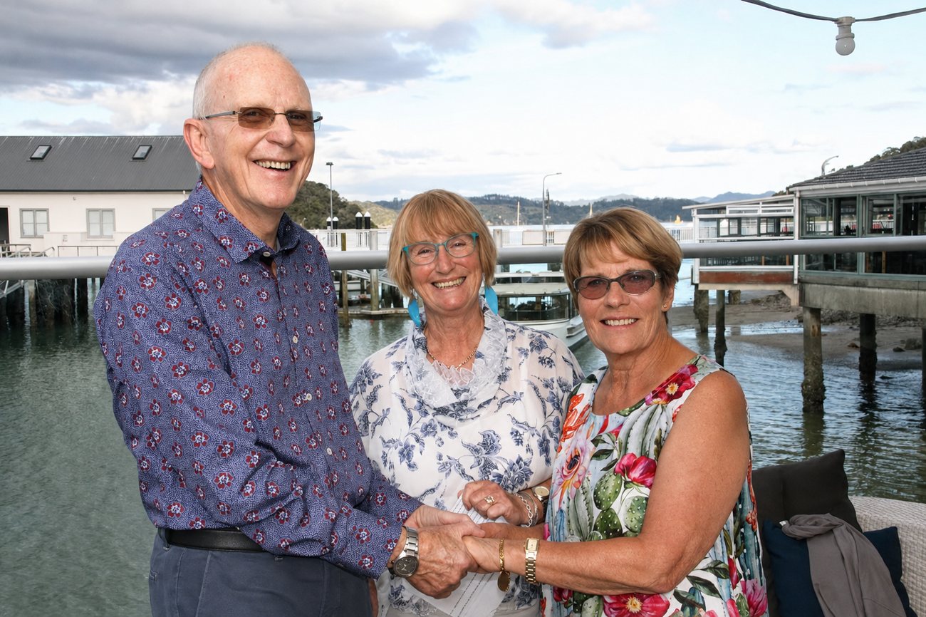 Chris with a couple on the waterfront at Paihia after their ceremony